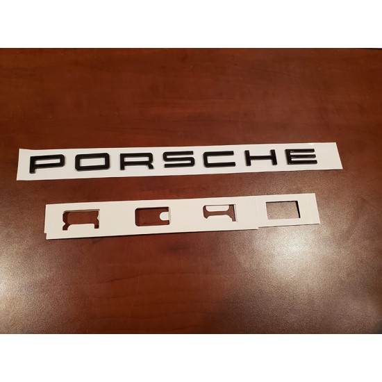 Black PORSCHE letters emblem